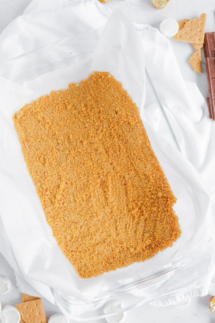 Graham cracker crust pressed in baking dish