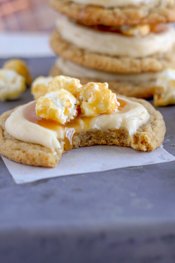 A Caramel Popcorn Cookie with a bite taken out of it