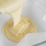 White Chocolate Mummy Fudge being poured into pan