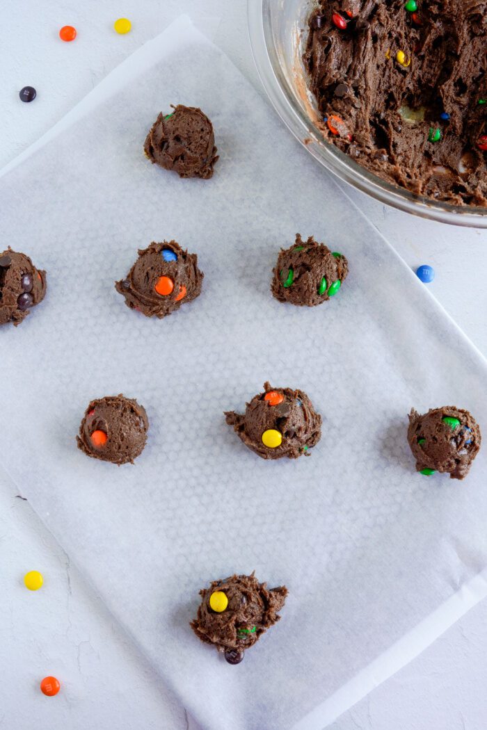 Cookie dough balls on prepared pan