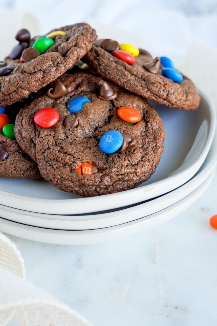 Several M&M cookies on a plate