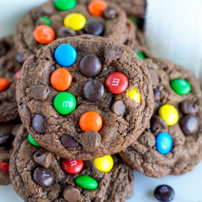 Close up of several M&M Cookies in a pile