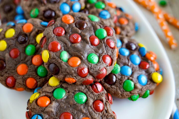 Wide view of plate of Mini M&M Brownie Cookies