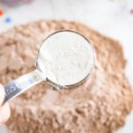 Flour being added to the mixing bowl