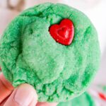 Grinch Sugar Cookies in hand