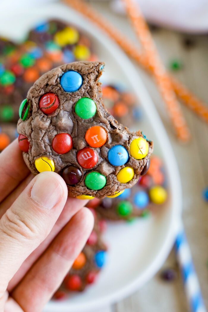 Someone holding a Mini M&M Brownie Mix Cookie