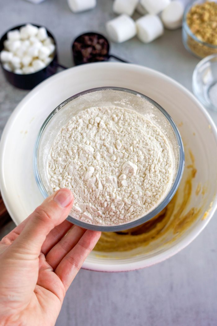 Flour being added to mixing bowl