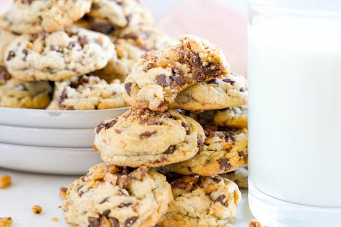 Pile of Toffee Cookies beside a glass of milk