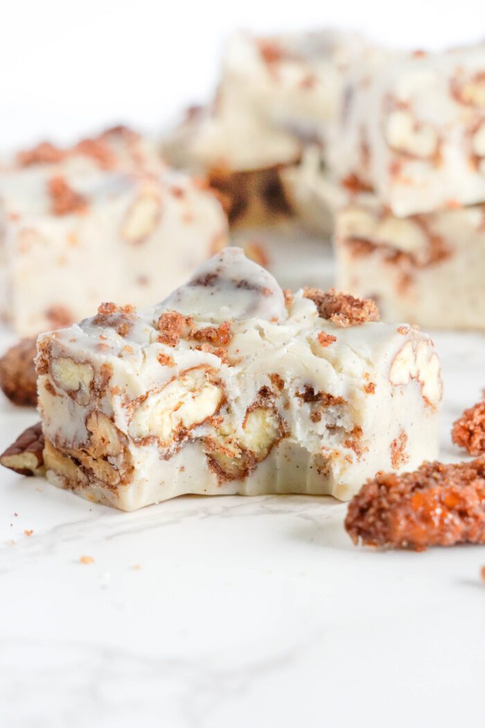 Bite taken out of White Chocolate Pecan Fudge square