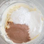Hot Chocolate Mix, marshmallow creme, and confectioners sugar added to bowl