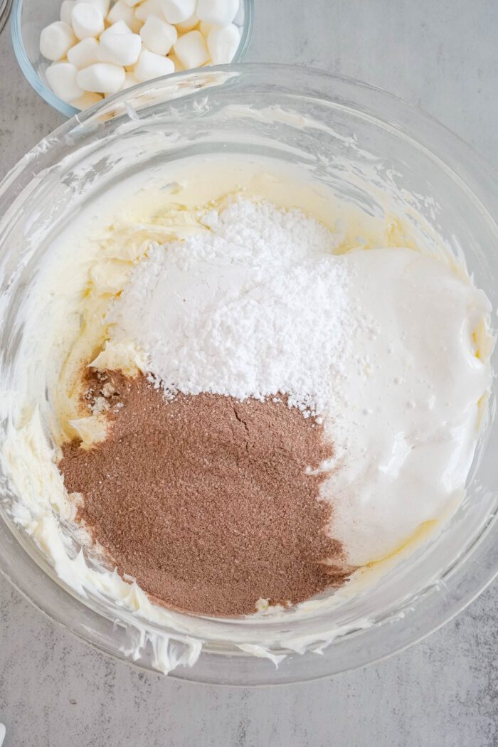 Hot Chocolate Mix, marshmallow creme, and confectioners sugar added to bowl