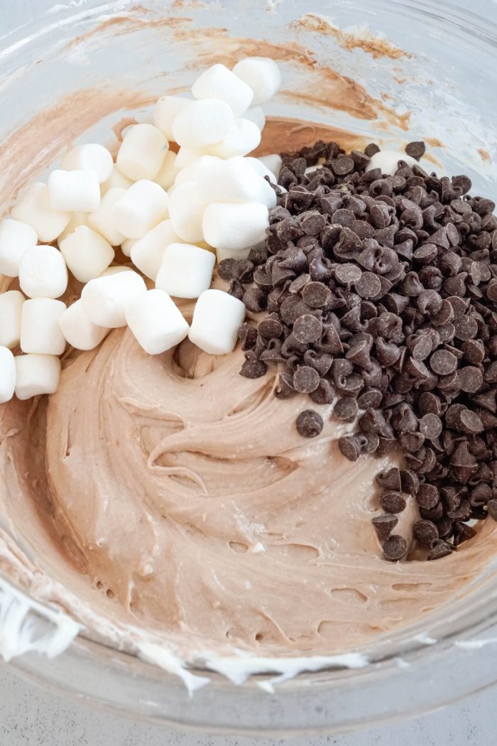 Marshmallows and chocolate chips added to bowl