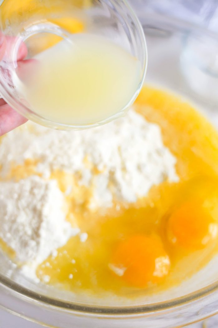 Adding lemon juice to bowl of ingredients