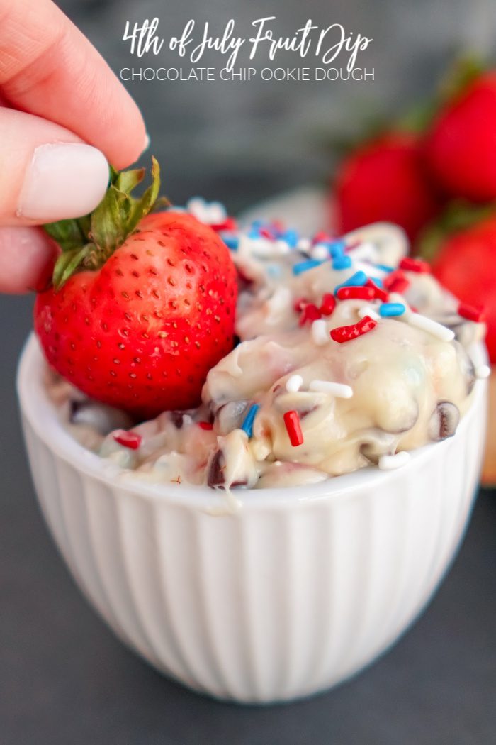 Strawberry being dipped into Chocolate Chip Cookie Dough Fruit Dip
