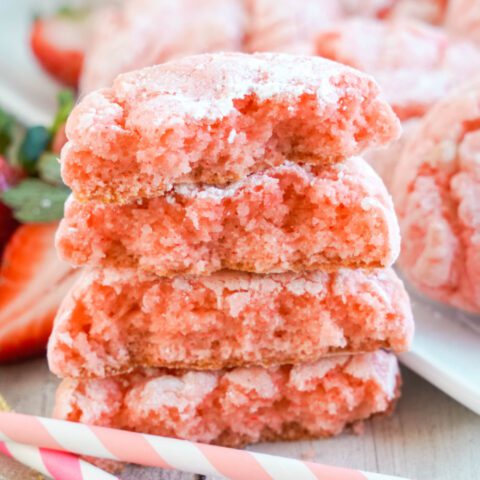 4 Strawberry Crinkle Cookies stacked and sliced in half