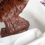 Pouring chocolate fudge into pan for Easter Fudge