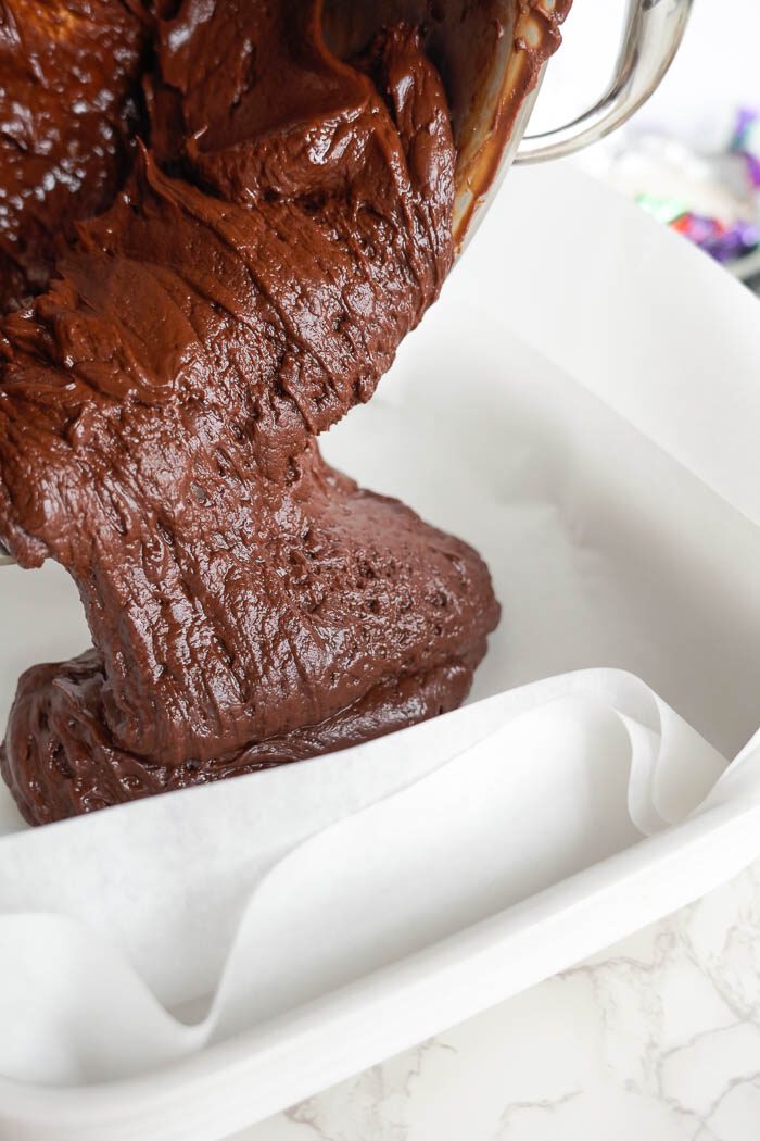 Pouring chocolate fudge into pan for Easter Fudge