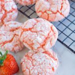 Strawberry Crinkle Cookies on a cooling rack