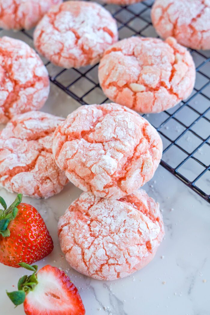 Strawberry Crinkle Cookies on a cooling rack