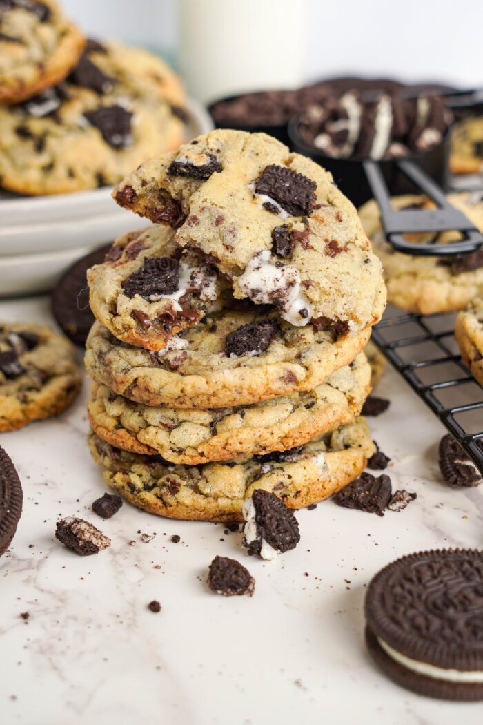 Oreo Cookies stacked with a broken cookie on top