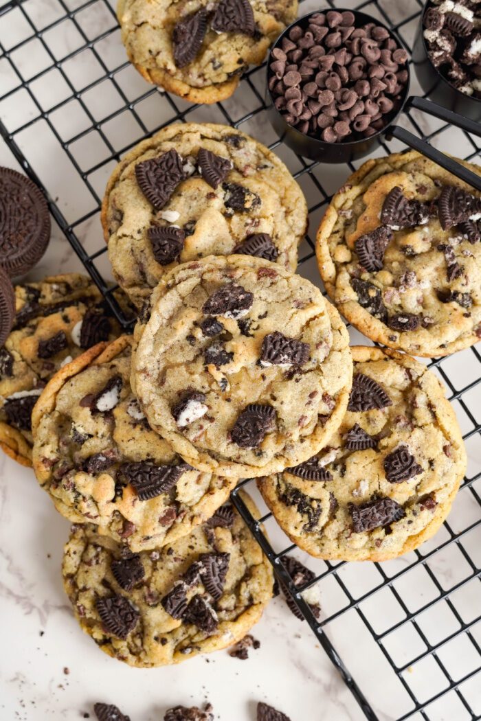 Easy Oreo Cookies Recipe with Chocolate Chips in a pile on cooling rack