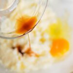 Key Lime Coconut Cookies adding egg and vanilla
