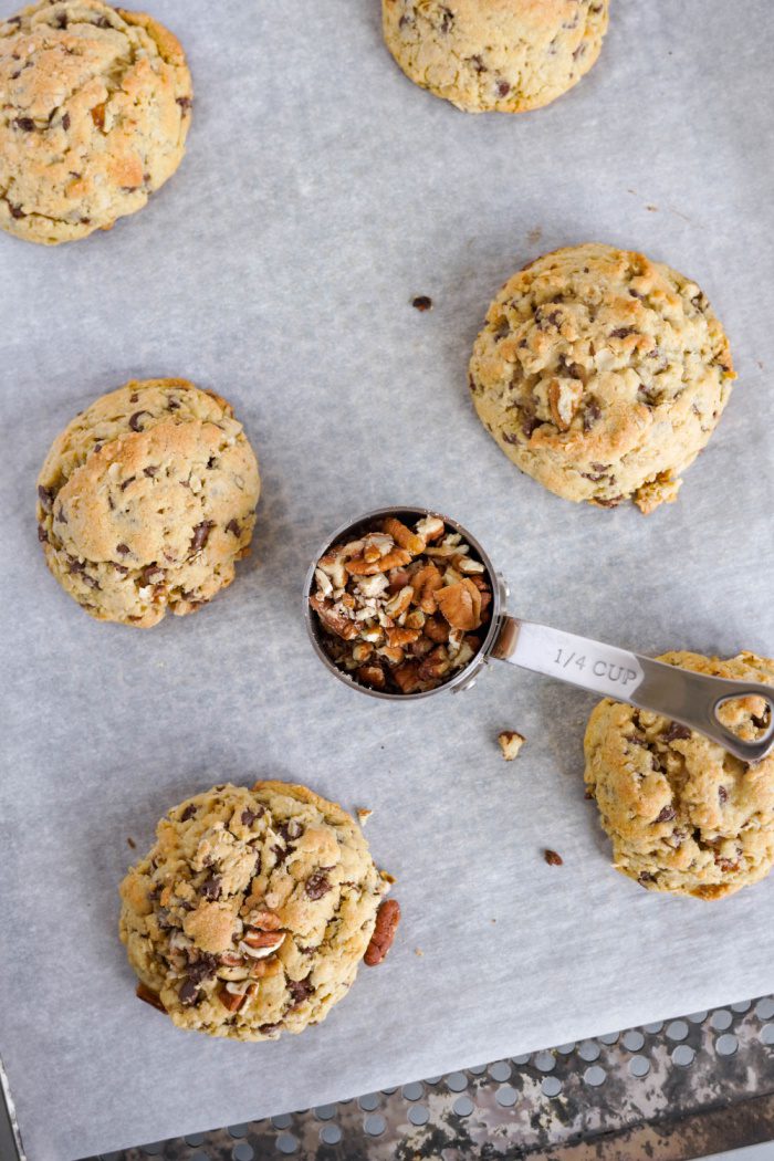 Oatmeal Chocolate Chip Cookies topped with pecans