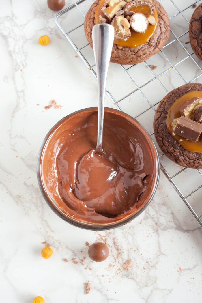 Candy Bar Brownie Cookies with melted chocolate drizzle