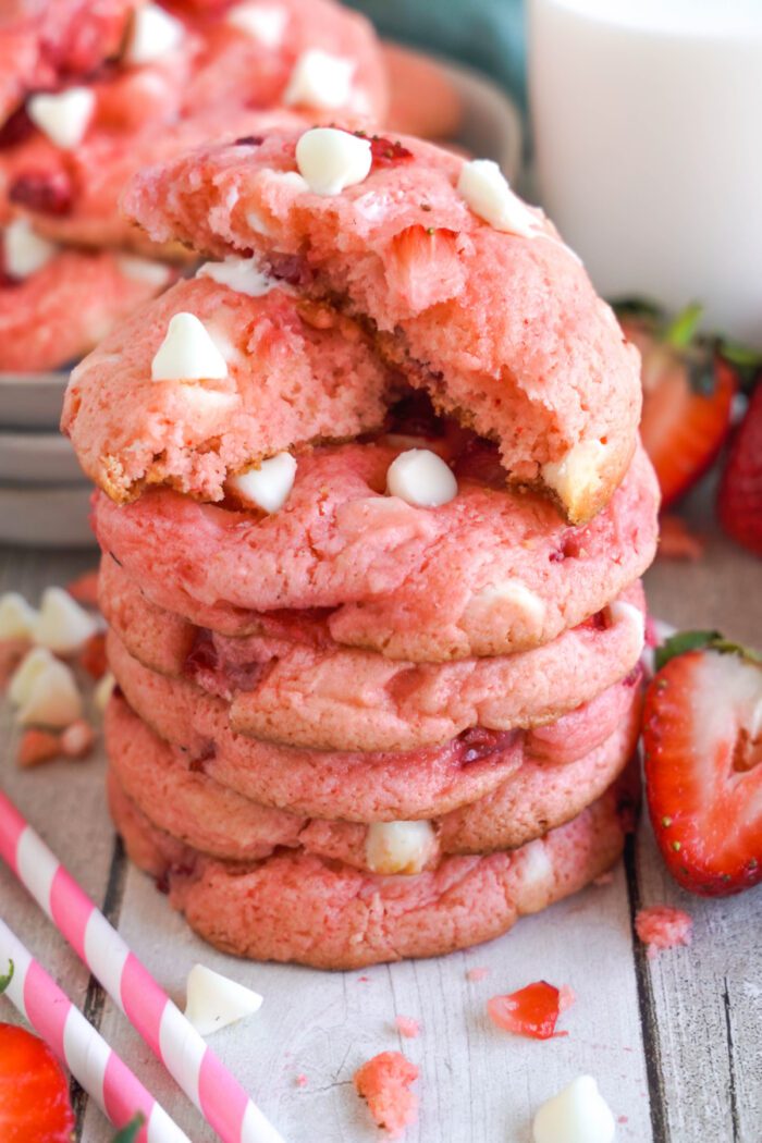 Strawberry White Chocolate Cake Mix Cookies stacked with a broken one on top