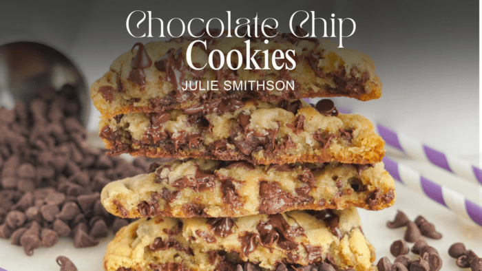 A stack of thick and chewy chocolate chip cookies with chocolate chips scattered around. Text overlay reads "Chocolate Chip Cookies" and "Julie Smithson.