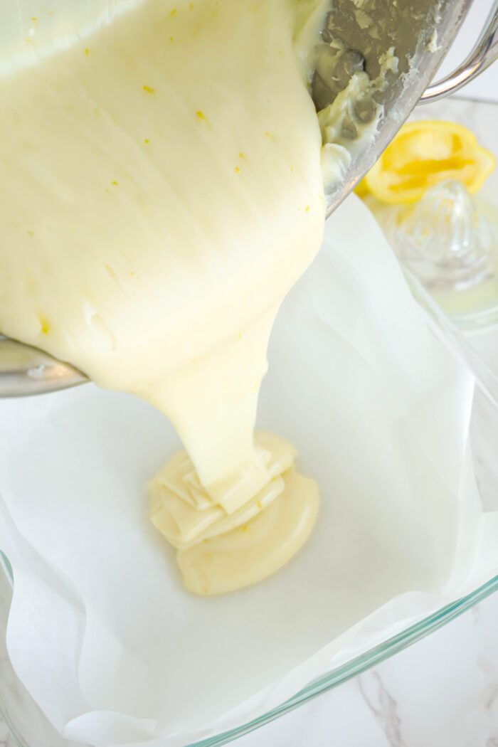 Easy Lemon Fudge being poured into baking dish