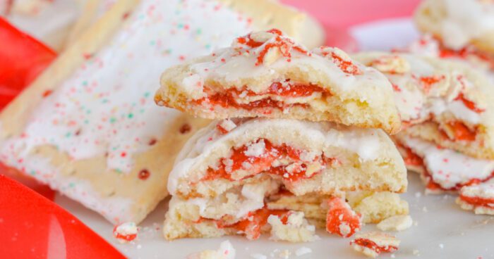 Easy Strawberry Pop Tart Cookies stacked with 3 broken cookies