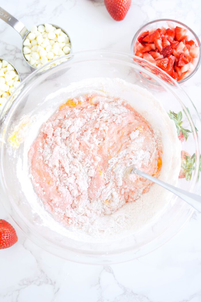 Strawberry Cake Mix Cookies mixing ingredients together