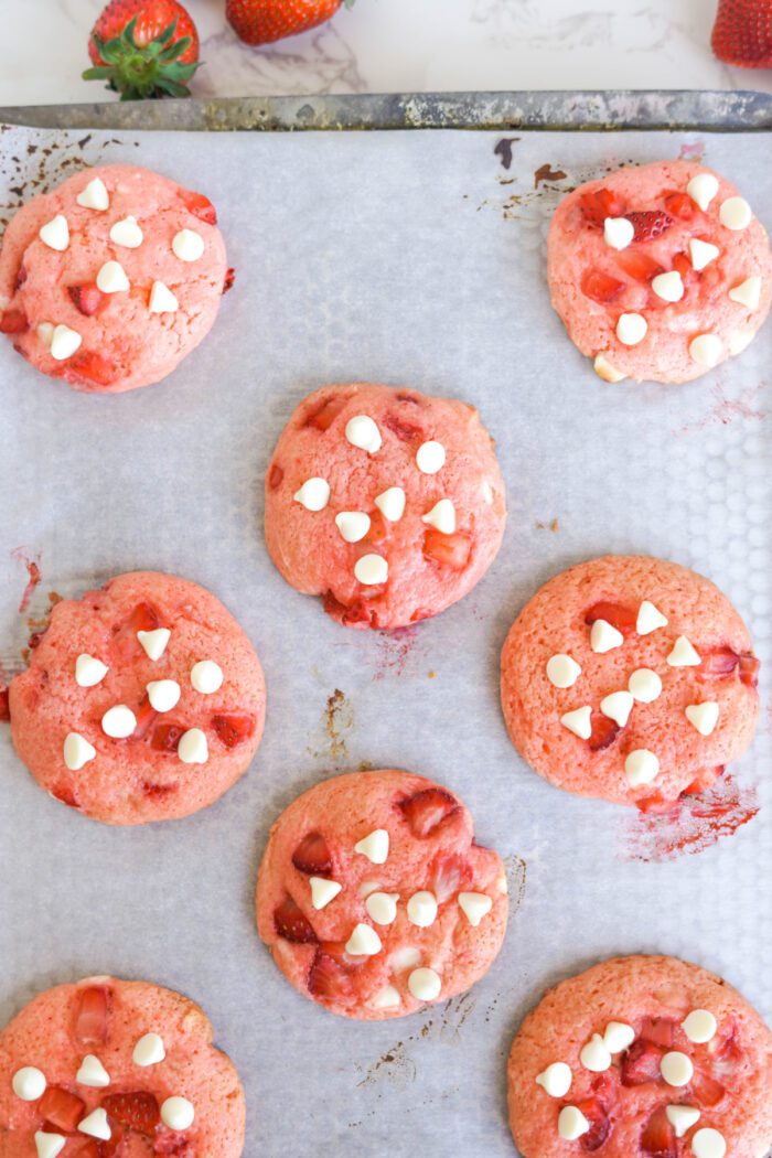 Strawberry Cake Mix Cookies topped with white chocolate chips