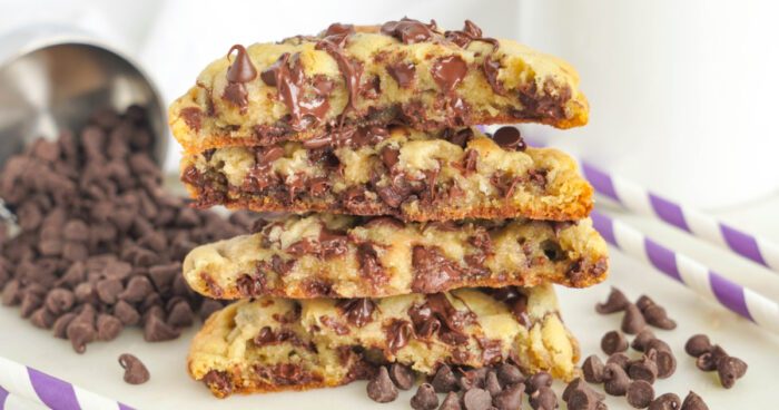 Thick and Chewy Chocolate Chip Cookies stacked and sliced in half