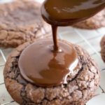 Cosmic Brownies Cookies being topped with chocolate glaze