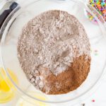 Cosmic Brownies box mix and cocoa powder in bowl