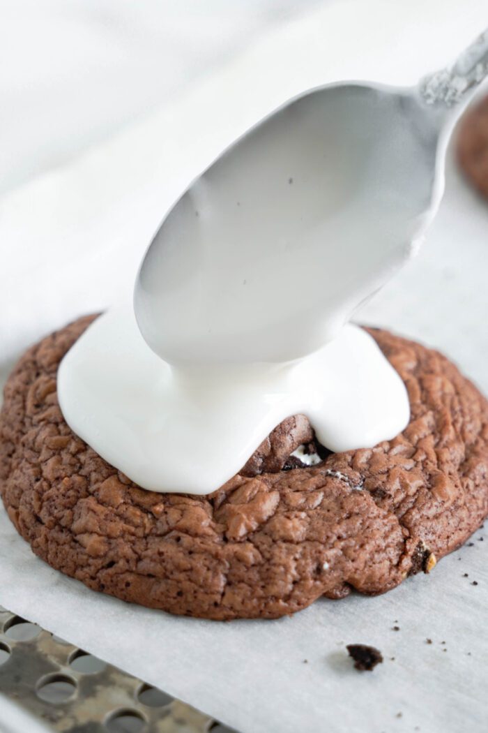 Pop Tart Cookies and Creme Cookies Recipe pouring frosting on cookies