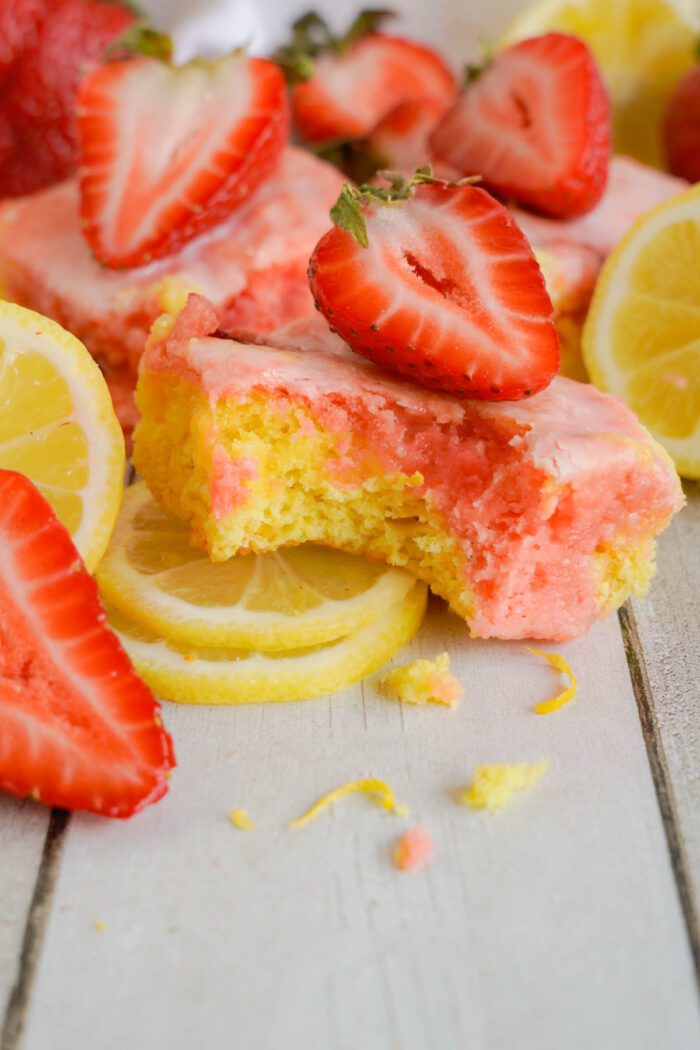 Strawberry Lemonade Brownies propped up on lemon slice