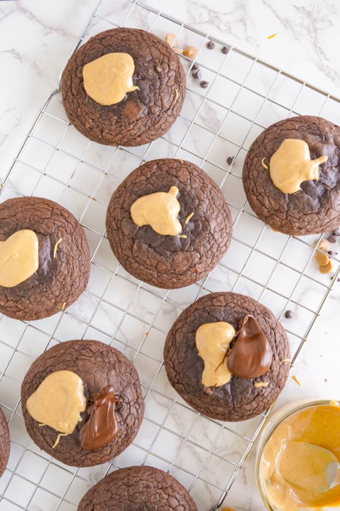 Peanut Butter Brownie Cookies on baking sheet with topping