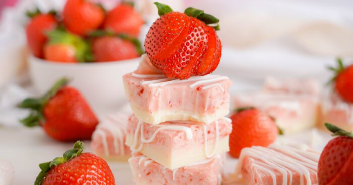 Strawberry Swirl Fudge with several strawberries