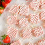 Strawberry Fudge cut into squares and drizzled with almond bark