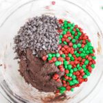 Christmas M&M Chocolate Brownie Cookies adding chocolate chips and M&Ms