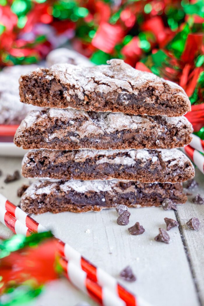 Chocolate Christmas Crinkle Cookies stacked and sliced in half