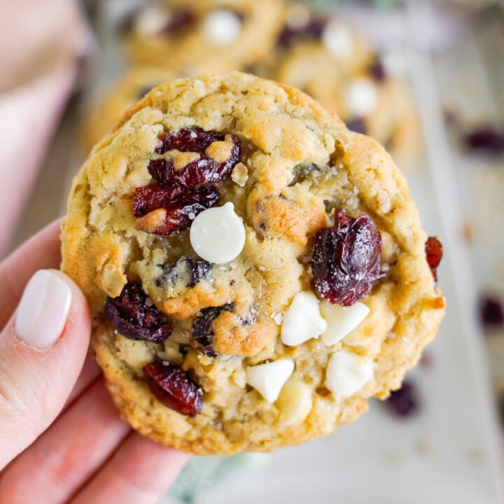 Easy White Chocolate Chip Cranberry Oatmeal Cookie being held up