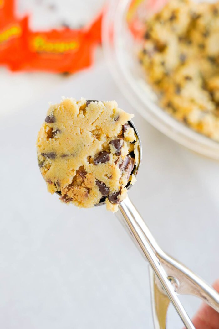 Reese's Stuffed Chocolate Chip Cookies dough balls being scooped