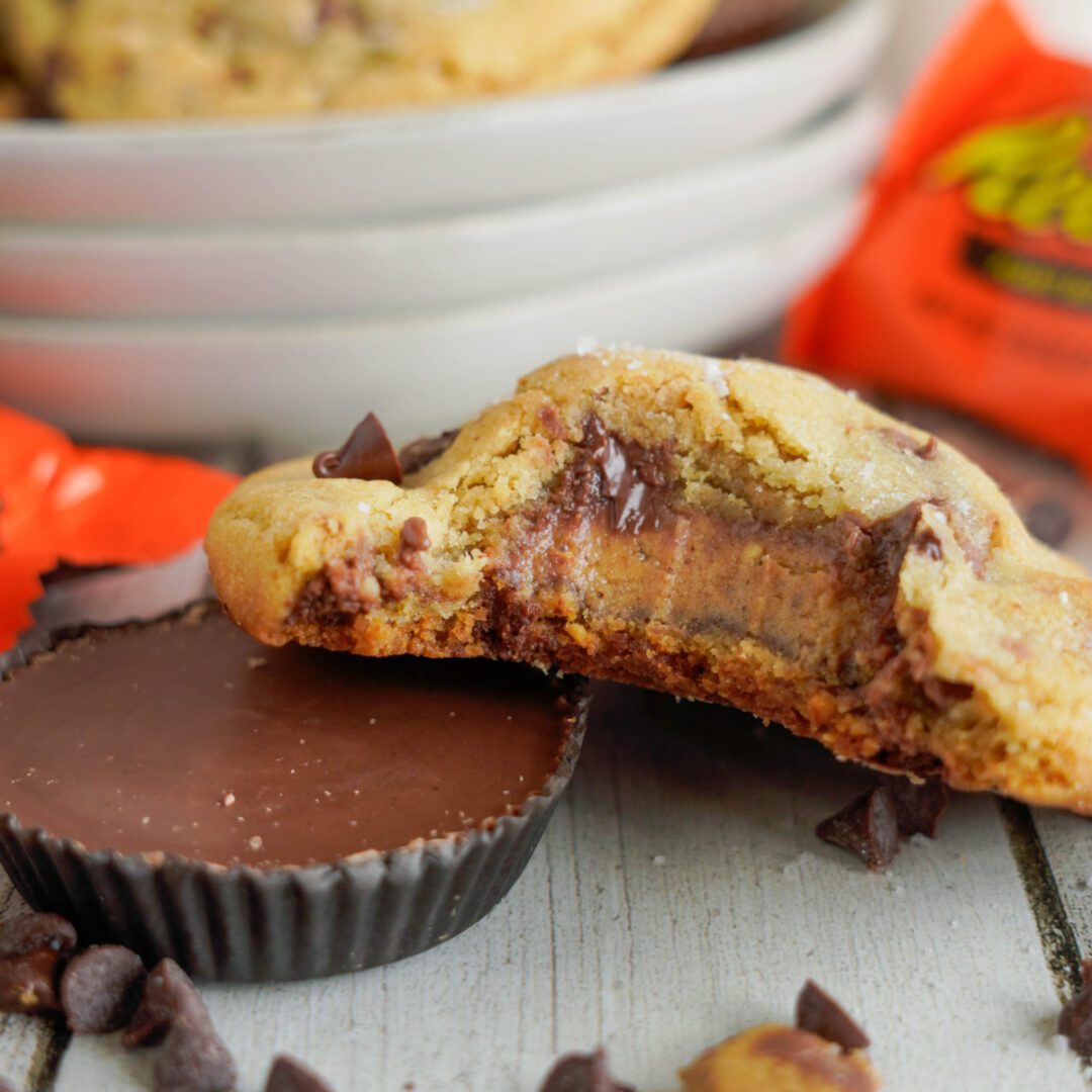 Reese's Stuffed Peanut Butter Chocolate Chip Cookies with bite taken out