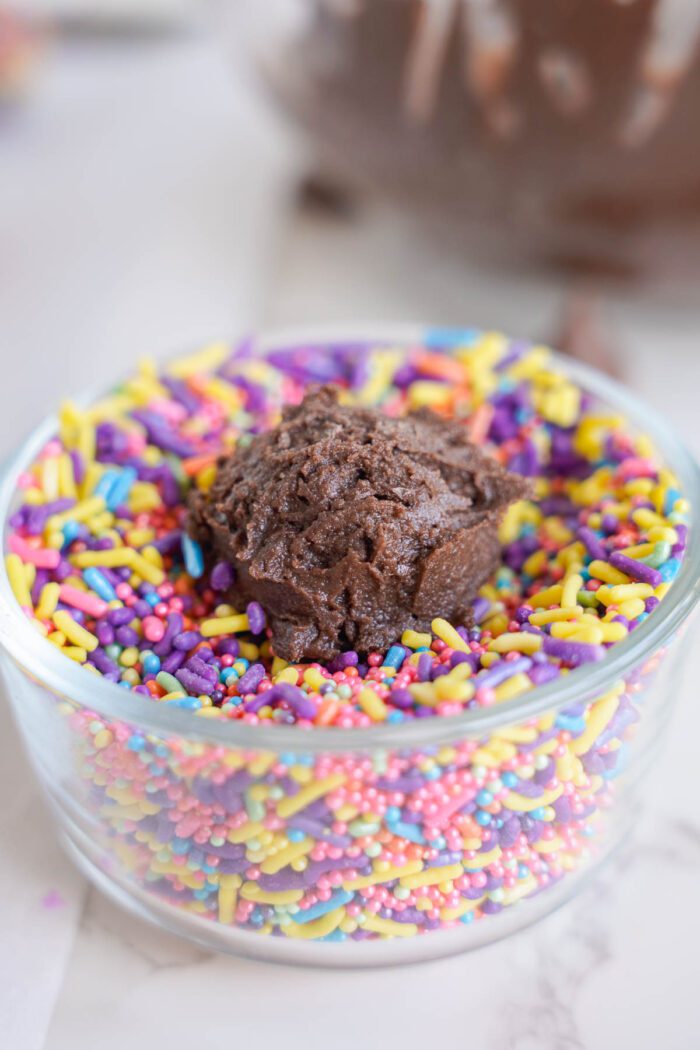 A bowl filled with Easy Brownie Cookies and sprinkles for Easter.