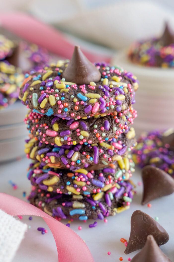 A stack of Easy Brownie Cookies for Easter with sprinkles on top.