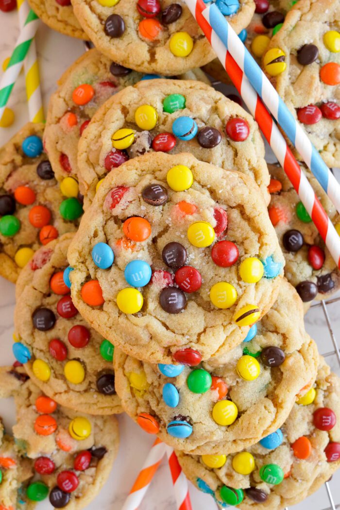 Freshly baked Peanut Butter M&M Cookies studded with colorful candy pieces, ready to enjoy.